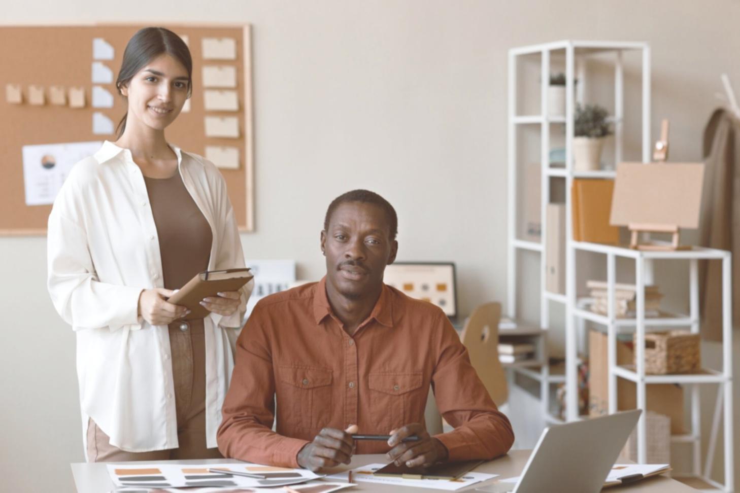 Investment analysis workspace with financial charts and research materials