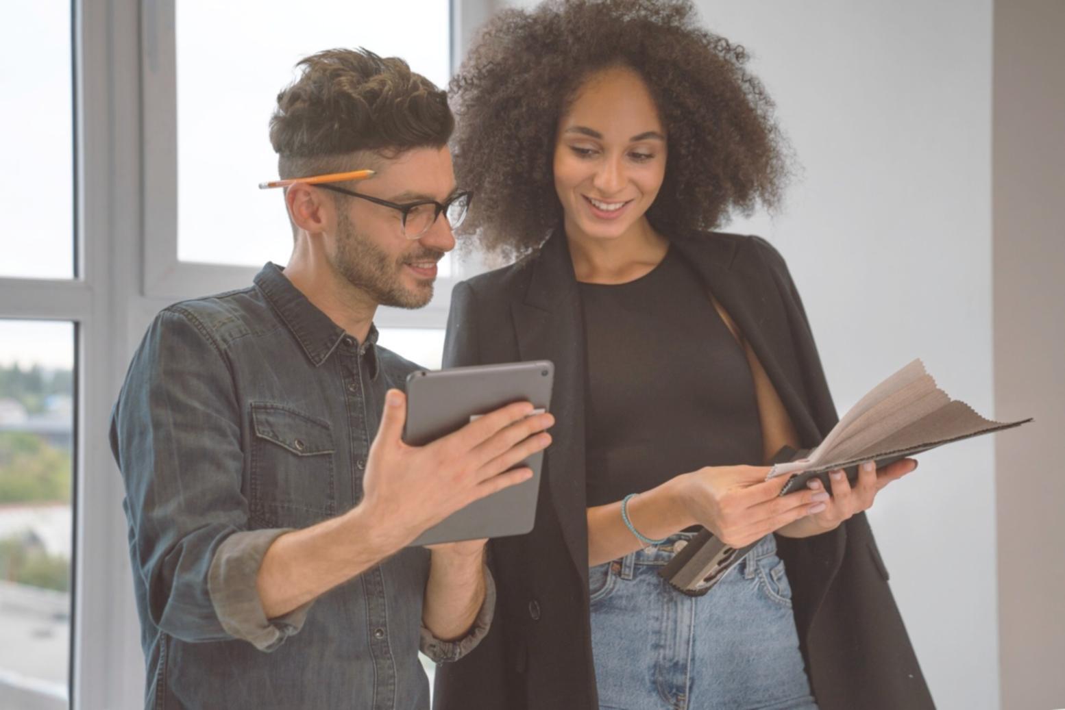 Students reviewing investment portfolio analysis worksheets